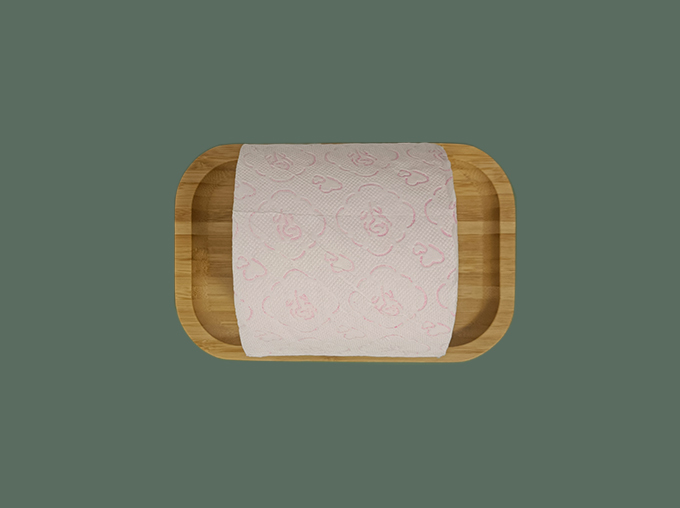 front view of pink toilet paper in a tray